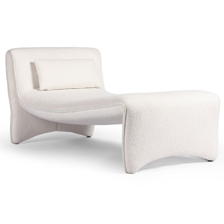 an upholstered white chair and footstool on a white background with no one in it