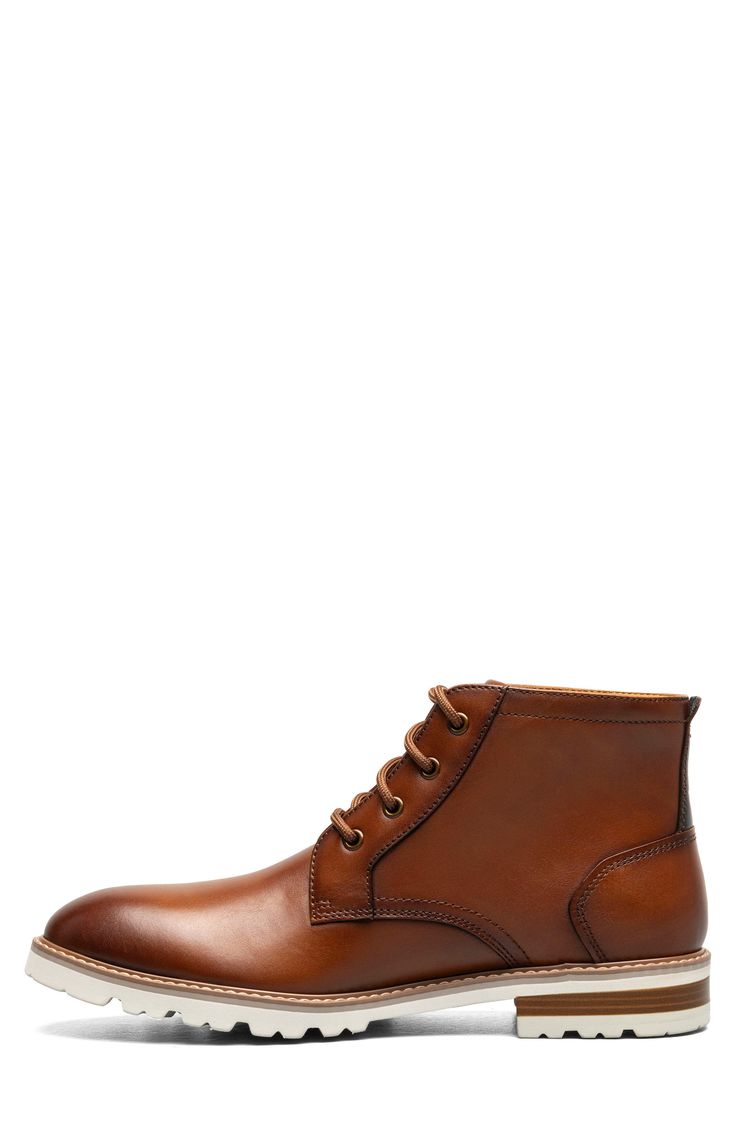 A stitched welt and sturdy lugs lend rugged appeal to a smooth leather lace-up boot with a padded collar and cushioned insole built for comfort. Lace-up style Removable, cushioned insole Leather upper/textile lining/rubber sole Imported Brown Business Martin Boots With Plain Toe, Brown Moc Toe Lace-up Boots With Leather Footbed, Brown Leather Martin Boots With Plain Toe, Leather Martin Boots Moc Toe For Fall, Formal High-top Leather Martin Boots, Classic Martin Boots With Goodyear Welt And Round Toe, Classic Ankle Lace-up Boots With Lug Sole, Classic Lace-up Ankle Boots With Lug Sole, Classic Brown Martin Boots For Business