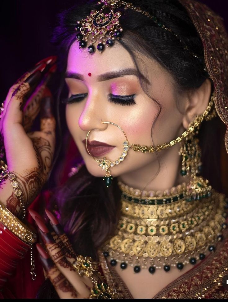 a woman with makeup and jewelry on her face