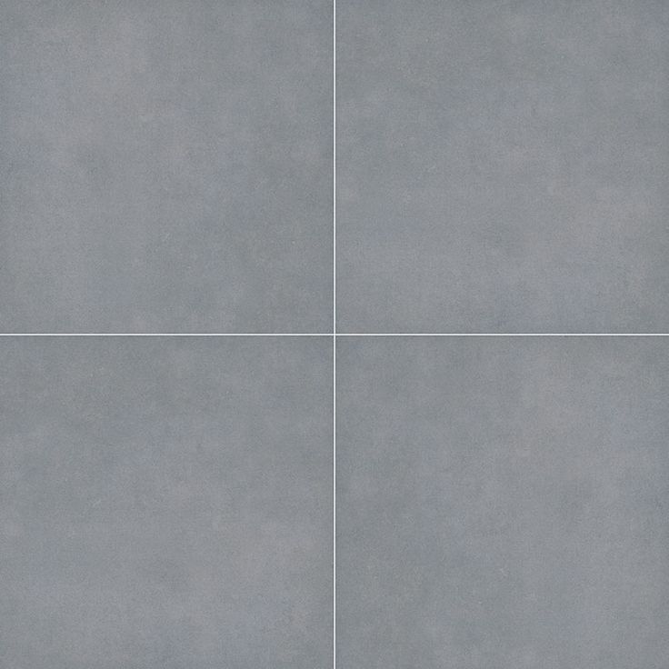 a gray tile floor with four squares in the middle