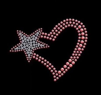 a heart made out of pink pearls with a star on the middle and an arrow in the middle