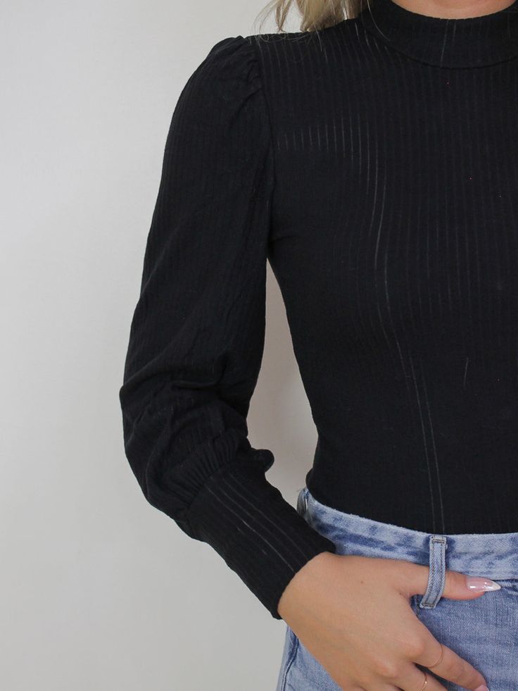 Black, long sleeve top with gold button details along the back Ribbed, knit, soft fabric Mock neck neckline Bishop style sleeves BUST WAIST LENGTH SMALL 30" 24.5" 20.5" MEDIUM 31" 26" 21" LARGE 32" 27.5" 21.5" MATERIAL/CARE: 95% Rayon . 5% Spandex Hand wash / lay flat to dry Long Sleeve Knit Top, Jewel Necklace, Candles For Sale, Black Long Sleeve Top, Long Sleeve Knit Tops, Earring Sale, Gold Buttons, Waist Length, Long Sleeve Knit