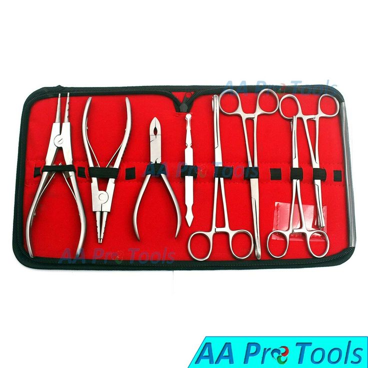 an assortment of surgical instruments in a red case with black trimmings and handles