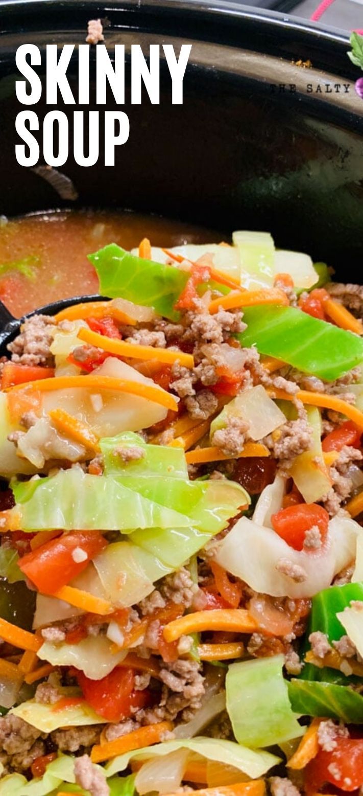 a close up of a skillet filled with meat and veggies on the side