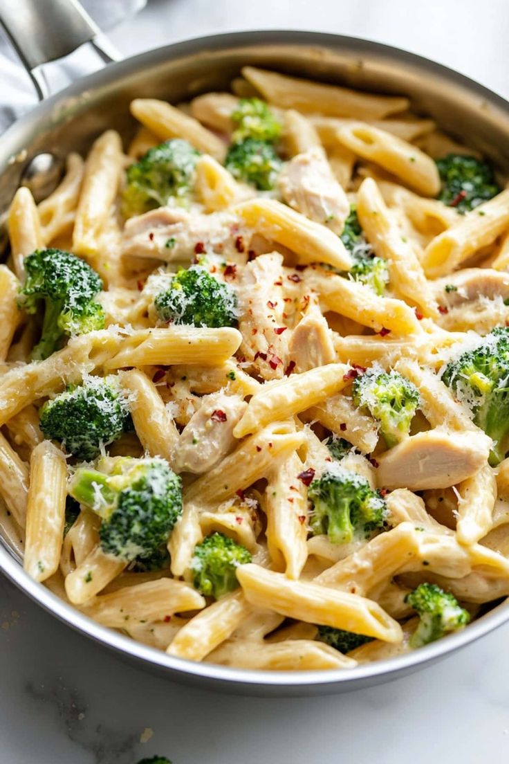 pasta with chicken and broccoli in a pan