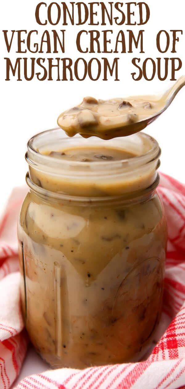 a jar filled with vegan cream of mushroom soup on top of a red and white checkered towel