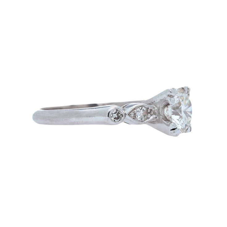 Hanbury is a stunning and authentically vintage Mid-Century platinum and diamond engagement ring. This classic creation showcases a box-set Round Brilliant Cut diamond weighing 0.93ct and graded G-H color and VS2 clarity. The ring is further enhanced by two Single Cut diamonds on each shoulder in an alternating pattern of round bezel-set and marquise shaped frame-set. Hanbury is currently a size 5.25 and can be sized to fit. Frame Set, Round Brilliant, Diamond Stone, Round Brilliant Cut Diamond, Bezel Setting, Brilliant Cut Diamond, Diamond Engagement, Vintage Collection, Diamond Engagement Rings