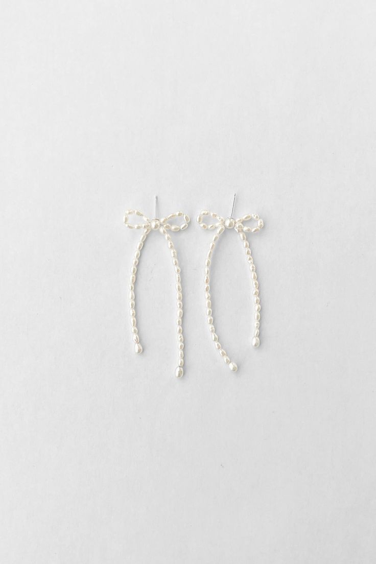 The Margot in Petite Pearl are exclusive to New York based boutique, Catbird! They asked for a slightly smaller loop and shorter tails and we answered with two different pearl styles. You can also find Margot as a necklace or as earrings in sterling silver - which are equally as versatile and dainty. Learn more about the Margot Collection here. Hoop Charms, Cord Necklace, Chain Ring, Pearl Bracelet, Earring Necklace, Rings Statement, Statement Earrings, Anklets, Pearl Necklace