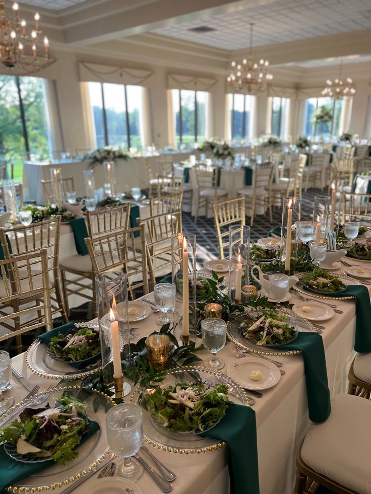 the tables are set with green and white linens