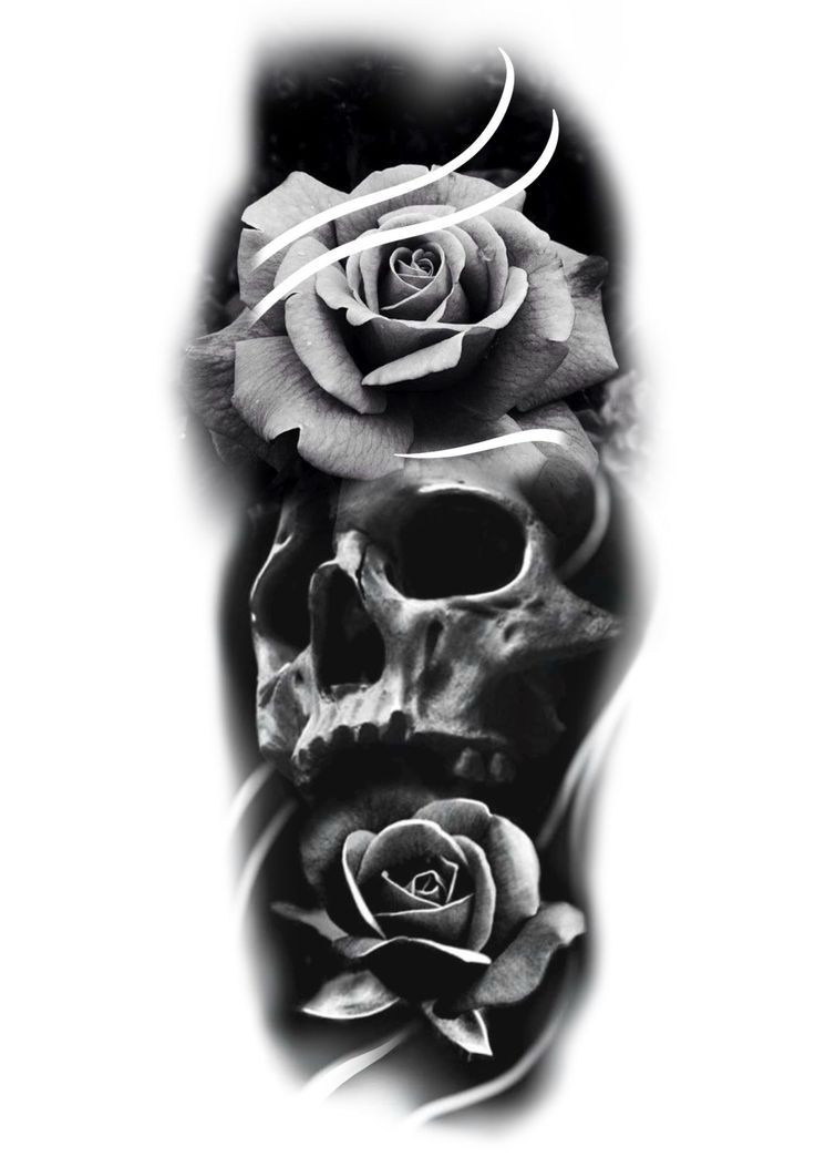 a black and white photo of a skull with two roses on it's side