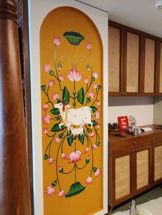 the kitchen is decorated with flowers and a cow painted on the wall above the sink