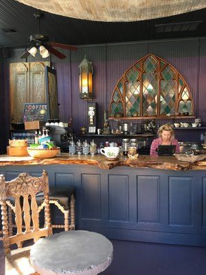 a woman sitting at a bar in a restaurant