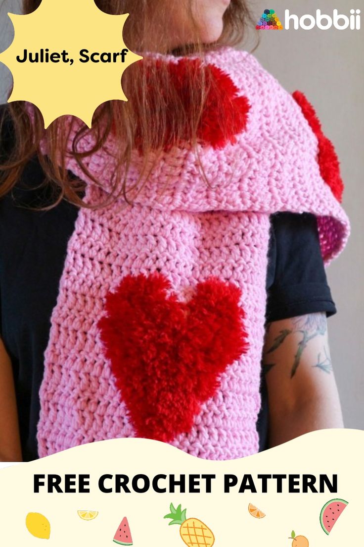 a woman wearing a pink crocheted scarf with a red heart on it