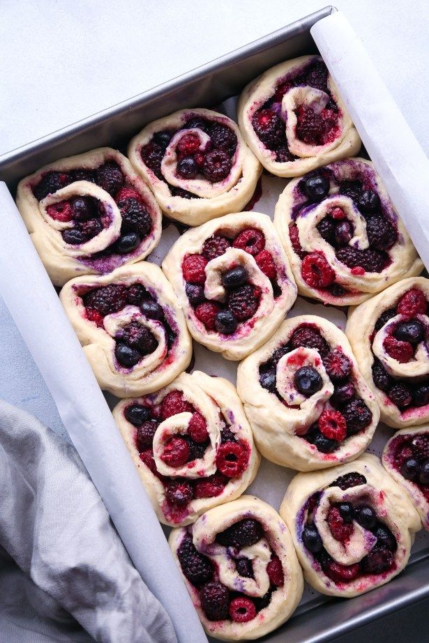 a pan filled with pastries sitting on top of a table