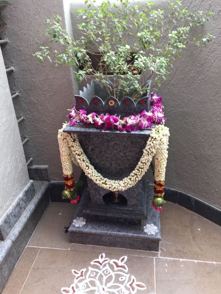 a potted plant sitting on top of a stone block