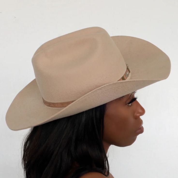 The Upland Western Cowboy Hat seamlessly blends the rustic charm of the Wild West with a dash of futuristic boho flair. With its distinctive cowboy silhouette, complete with a cattleman creased crown and a stylish upturned brim, this hat exudes classic Texan allure. The leather band is adorned with gleaming silver jewe Western Curved Brim Hat For Rodeo, Western Style Flat Brim Hat For Rodeo, Western Hat Band For Rodeo With Curved Brim, Fitted Country Style Top Hat For Rodeo, Western Flat Brim Hat For Rodeo, Western Curved Brim Hat Bands For Rodeo, Country Style Wide Brim Top Hat For Rodeo, Country Style Brimmed Top Hat For Ranch, Western Style Fitted Top Hat For Rodeo