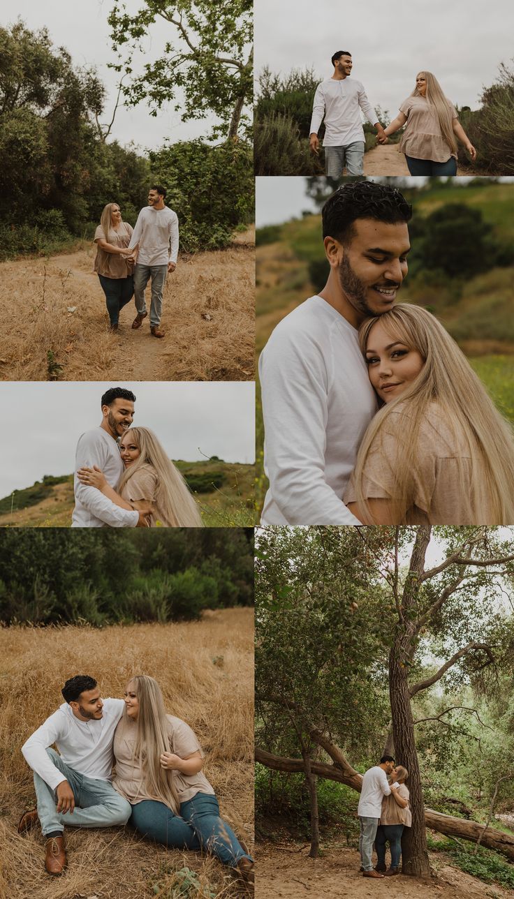 a man and woman sitting on the ground in front of a tree with their arms around each other