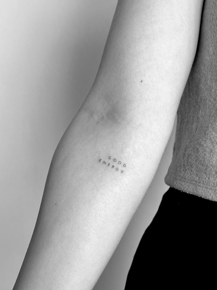 a person with a small tattoo on their arm