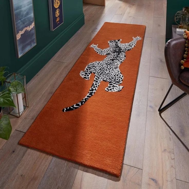 an orange area rug with a cheetah on it