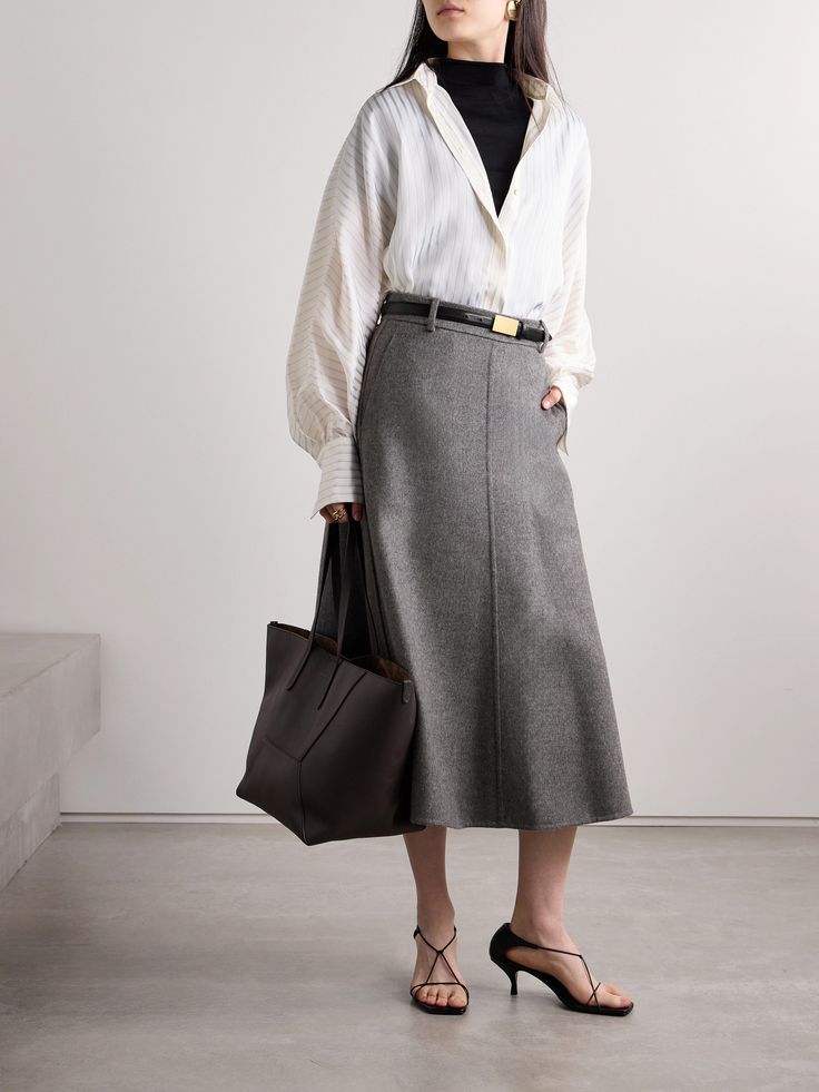 Brunello Cucinelli's midi skirt is tailored from wool-felt that holds a nice shape. Partially lined in satin for smoothness and comfort, it has a subtle, elongating front seam and belt loops at the high waist. Wear yours with the coordinating jacket for a cohesive look. Elegant Wool Midi Skirt, Elegant Full Skirt For Office, Chic Wool Midi Skirt, Chic Voluminous Skirt For Workwear, Elegant Wool Pleated Skirt, Elegant Wool Skirt For Formal Occasions, Elegant Semi-formal Fall Skirt, Tailored Chic Wool Skirt, Chic Tailored Wool Skirt