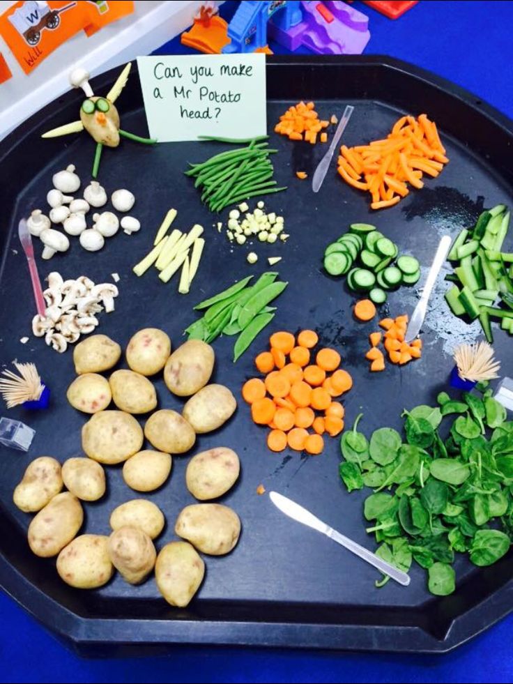 a tray filled with different types of vegetables next to a sign that says can you make a mr potato salad?