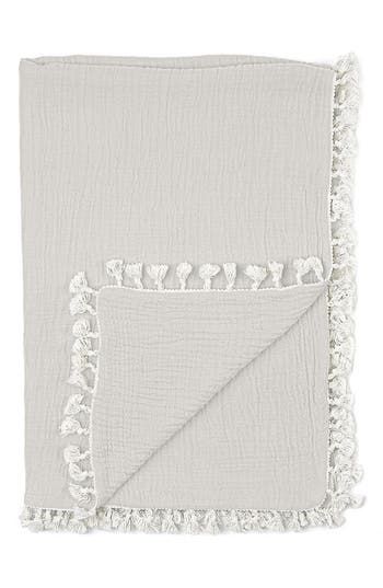 a white blanket with fringes on it