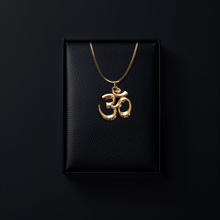 Connect with the sacred sound of the universe with our gold Om pendant, finely crafted in the USA. Representing the essence of ultimate reality, consciousness, and inner peace, each piece is a harmonious blend of spirituality and artistry. PENDANT INFORMATIONThis pendant is made of real, solid gold.• Made in USA• Size: Mini• Material: 14k or 18k solid gold• Finish: polished• Height: 0.9" (22,5 mm) | *includes the small circle, bail dimensions not included• Width: 0.85" (22 mm)• Pendant weight (a Amulet Style Jewelry With Polished Finish As Gift, Yellow Gold Round Pendant For Rituals, Gift Amulet Jewelry With Polished Finish, Gold Jewelry With Large Pendant For Rituals, Spiritual Round Pendant Necklaces For Rituals, Spiritual Jewelry With Large Round Pendant, Spiritual Engraved Pendant Jewelry, Symbolic Necklaces For Meditation And Festivals, Spiritual Locket Necklace For Meditation