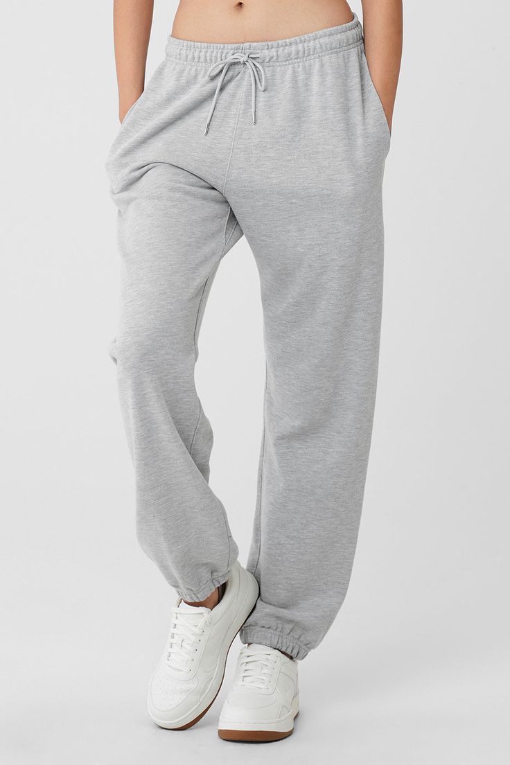 Cool down, warm up — the choice is yours with the Chill Sweatpant. Designed with ultra-soft, breathable French terry and a non-fuzzy, anti-cling interior, this lightweight bottom is made to hang or make moves. Classic cuffed bottoms, external drawcords and side-zippered pockets make this an everyday essential to wear on repeat. Soft, lightweight everyday sweatpant For working out and wearing out Designed & uniquely fit for every size Wear-tested by our in-house team for the perfect fit Comfortable Solid Color Lounge Pants, Comfortable Full-length Bottoms, Loosely Fitted Solid Sweatpants For Sports, Sportswear Sweats With Elastic Waistband For Lounging, Sporty Cotton Bottoms By Alo Yoga, Sporty Alo Yoga Bottoms, Alo Yoga Solid Color Pants With Pockets, Alo Yoga Relaxed Fit Sports Bottoms, Alo Yoga Bottoms With Ribbed Waistband