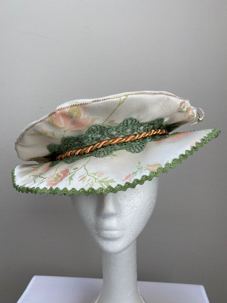 New women's Renaissance Medieval Elizabethan Victorian cream brocade brim hat cap size small. This stunning brim hat is embellished with a green lace trim secured by a salmon cord. Brim is 3" wide embellished with green trim. Great for your next theme party, stage production or Renaissance Faire. Sales final. New not worn. Adjustable Costume Bonnet, Curved Brim Costume Hat, Costume Hat With Curved Brim, Fitted Festival Costume Hat With Short Brim, Adjustable Costume Cap, Adjustable Cap For Costume, Curved Brim Top Hat For Kentucky Derby Costume, Adjustable Costume Hat For Kentucky Derby, Fitted Cap Style Mini Hat For Costumes