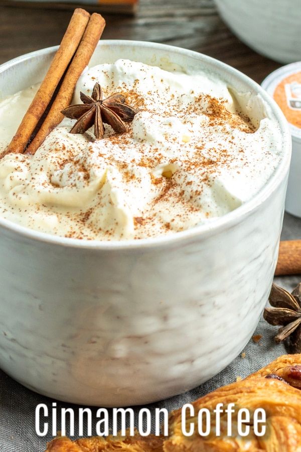 cinnamon coffee in a white bowl with cinnamon sticks and star anise on the side