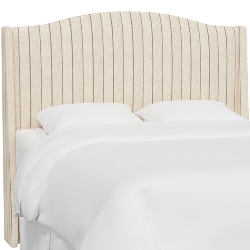 an upholstered headboard with pinstripe on the top and bottom panel