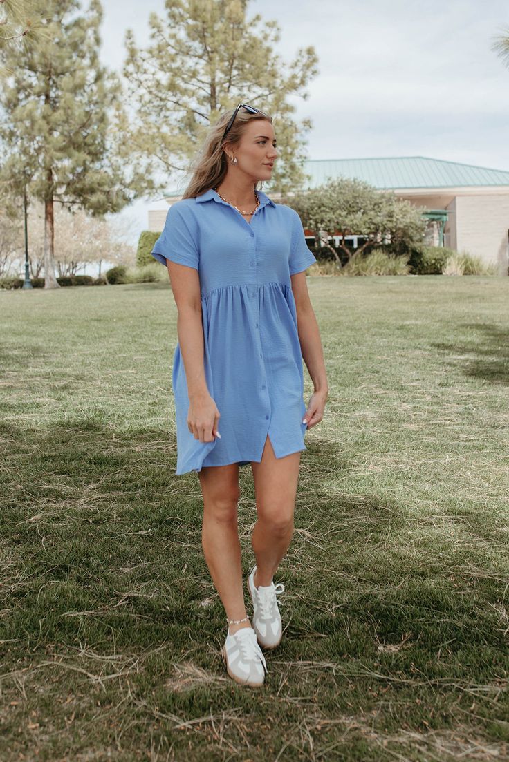 Lighten up your spring and summer wardrobe with THE HEIDI DRESS IN SOFT CHAMBRAY. This flowy blue dress is perfect for sunny days, featuring a collared neckline for a cute touch. Stay cool and stylish in this must-have piece. Paired with THE CASUAL SNEAKERS IN GREY Collared Button up Textured fabric 95% polyester 5% spandex Runs true to size. X-Small (00-2), Small (2-4), Medium (4-8), Large (8-12), X-Large (12-16) Model is 5'9" wearing a size small. Length (shoulder to hem): X-Small 35.5", Small 36", Medium 36.5", Large 37", X-Large 37.5" To view our return policy click here! Check out our try on video below!\