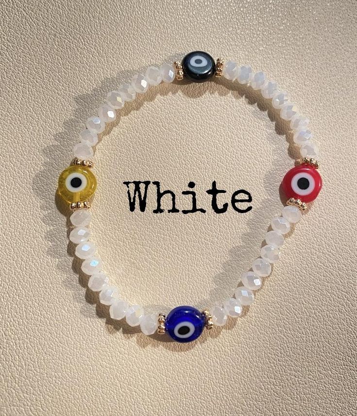 Handmade Acrylic Beaded Evil Eye Bracelet. If bracelet breaks while wearing please do not fix, it is known that the evil eye protection has used the magic within. It is believed that if your Evil Eye amulet cracks or breaks, it has done its job of protecting you from some misfortune or bad luck and should be replaced! Item Details & Care: 6.5 in. Beaded Stretchy Bracelet Acrylic Beads Removed while exercising, showering or swimming Removed before sleeping to avoid breakage Avoid using harsh Symbolic White Jewelry With Round Beads, Symbolic White Round Bead Jewelry, Symbolic White Beaded Bracelets As Gifts, White Adjustable Symbolic Bracelets, Adjustable White Symbolic Bracelets, Adjustable Symbolic White Bracelet, Symbolic White Bracelets With Round Beads, Symbolic White Round Bead Bracelets, Handmade White Symbolic Beaded Bracelets