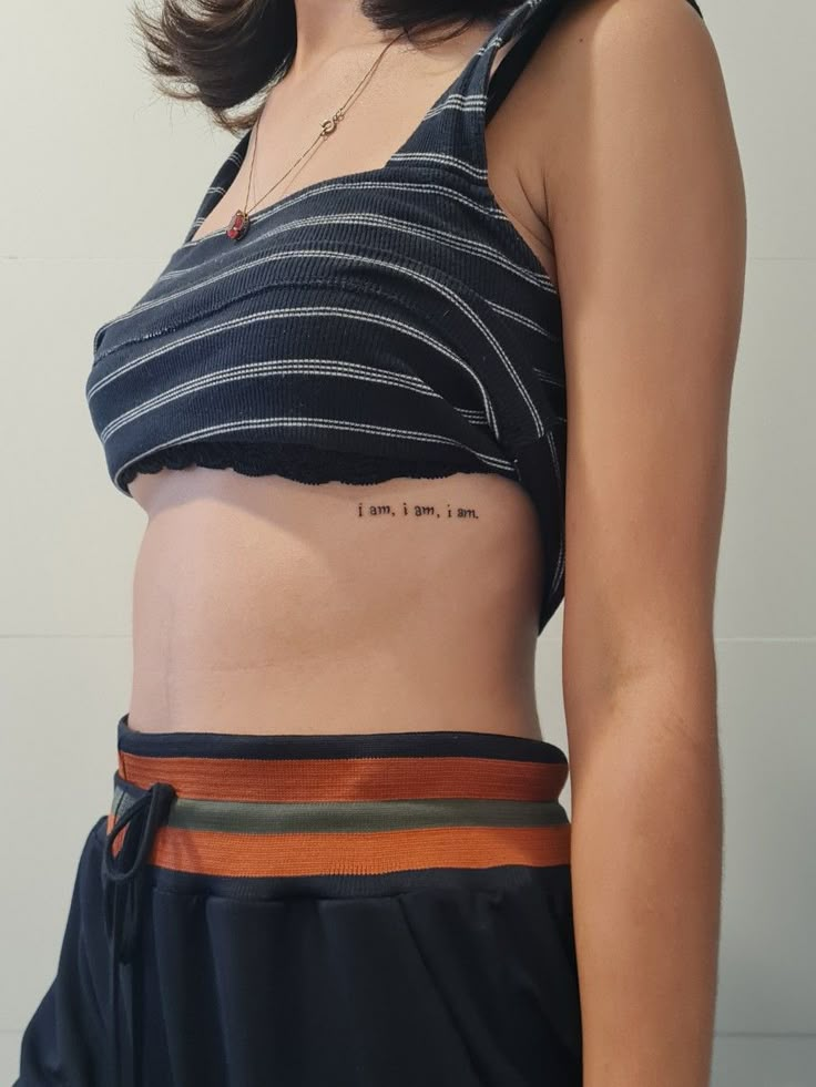 a woman's stomach with the words i love you in cursive writing