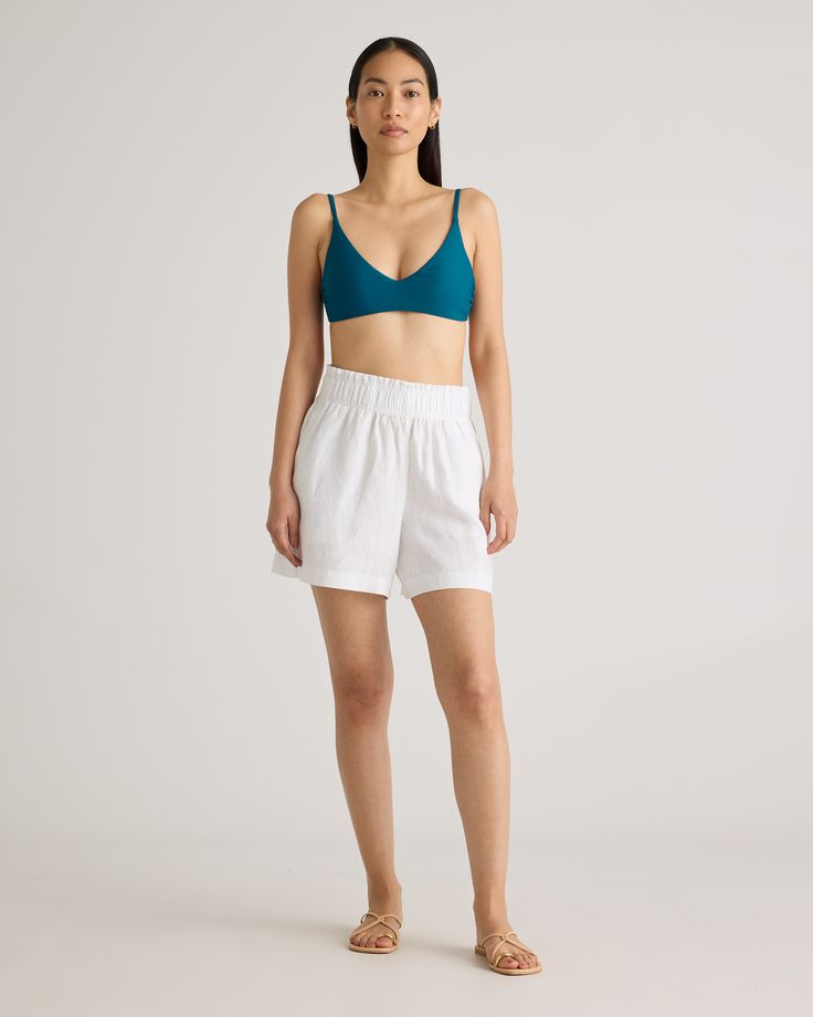 Elevate your summer style with our 100% European Linen High Waisted Shorts. Crafted from premium linen, these shorts offer a luxuriously lightweight and breathable option for warm weather dressing. The high rise silhouette elongates your legs and flatters your figure, while the relaxed fit keeps you comfortable all day long. Featuring a clean, minimalist design, these shorts are perfect for dressing up or down. Whether you're lounging at the beach or exploring a new city, our European Linen High White Linen Bermuda Shorts For Summer, Linen Beachwear Shorts With Elastic Waistband, Beachwear Linen Shorts With Elastic Waistband, Summer Bermuda Shorts For Beach With Short Inseam, Chic Knee-length Beach Shorts, Summer Bermuda Shorts With Short Inseam For Beach, Chic Knee-length Shorts For Beach, Summer Bermuda Shorts For Beach, Chic Bermuda Shorts For Beach In Relaxed Fit