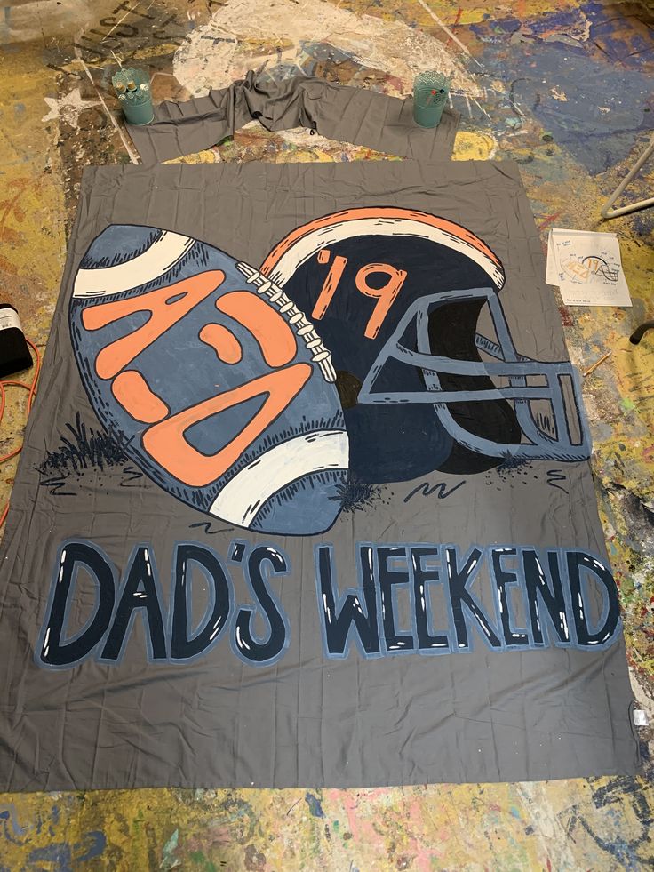 an old football jersey with the words dad's weekend painted on it