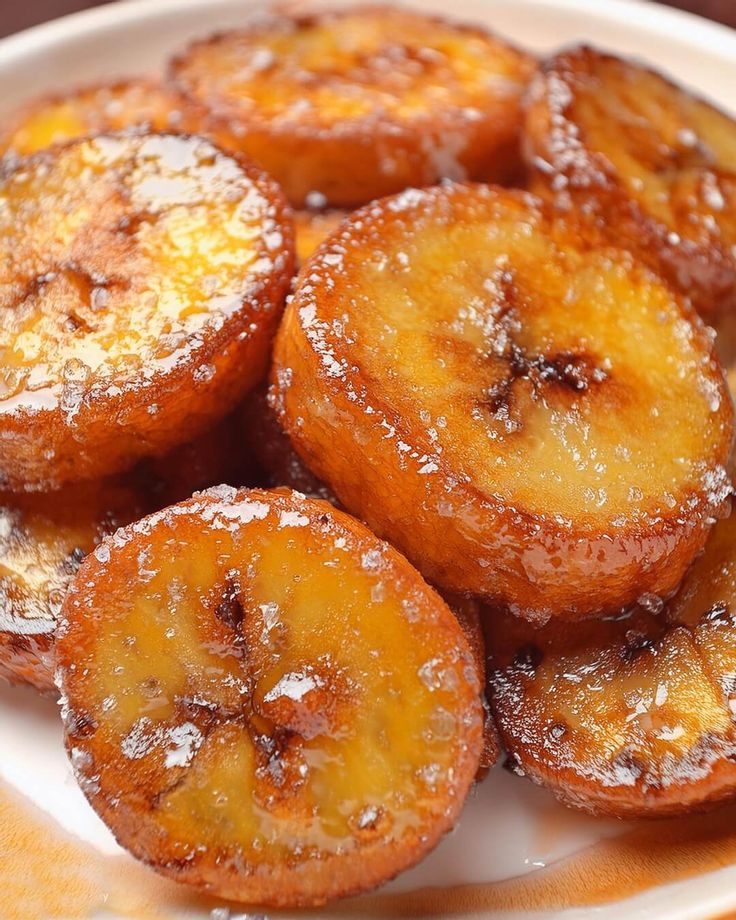 some sugar covered bananas on a white plate