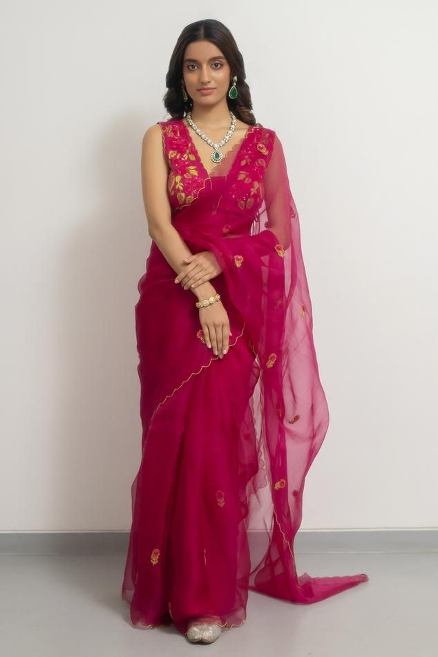 Rani pink silk organza saree with floral and sequins placement hand embroidery. Comes with a blouse.
Components: 2
Pattern: Hand embroidered
Type Of Work: Floral, Sequins
Neckline: Deep V Neck
Sleeve Type: Sleeveless
Fabric: Silk organza
Color: Pink
Other Details: 
Disclaimer : The product will dispose off some color, since it is hand dyed.
Occasion: Wedding - Aza Fashions Organza Pattu Sarees, Hot Pink Saree, Rani Pink Saree, Pink Organza Saree, Weddings 2024, Unique Sarees, Sleeveless Blouse Designs, Simple Saree Designs, Rani Pink