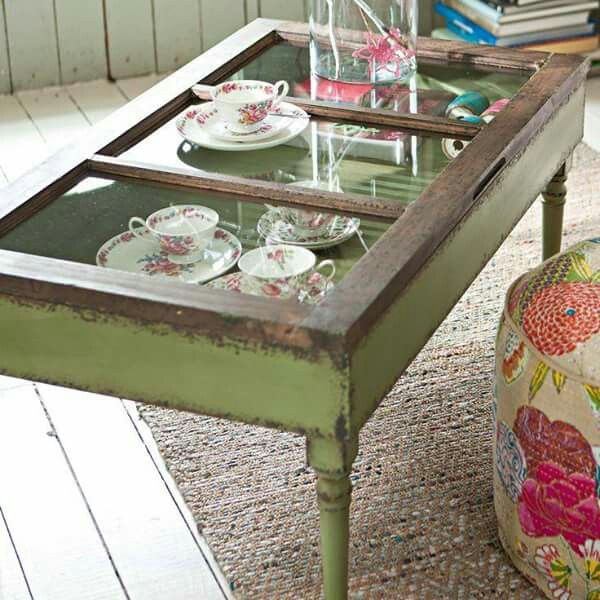 a coffee table with plates and cups on it