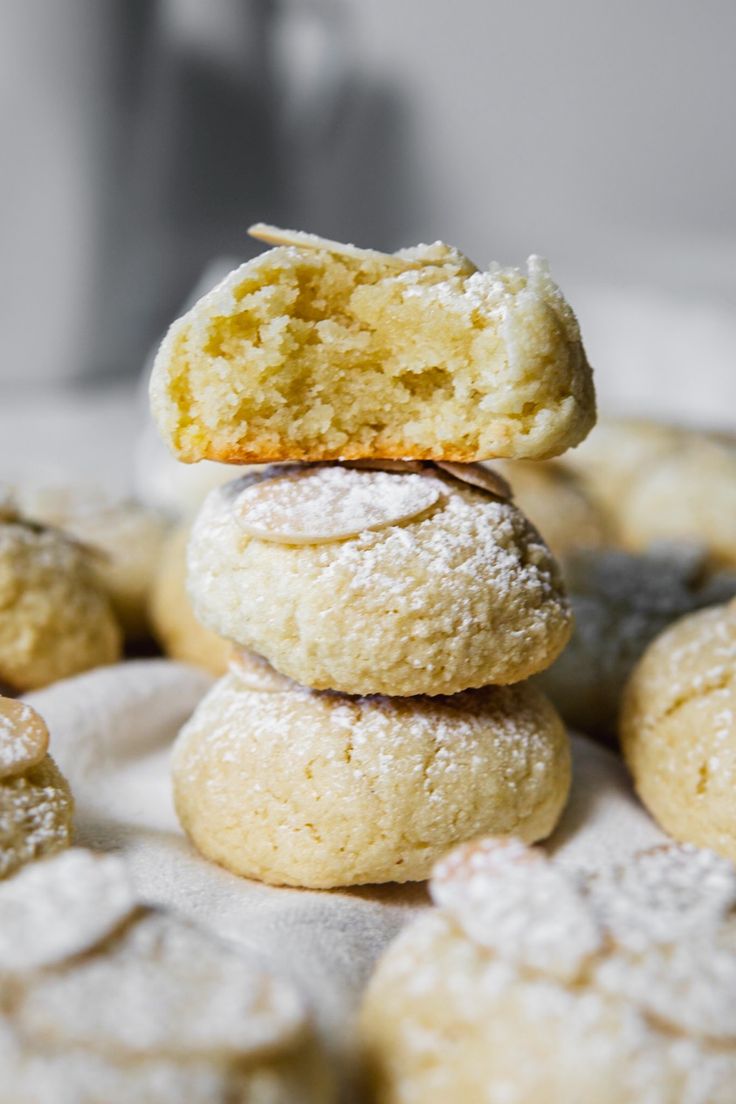 a stack of cookies with powdered sugar on top