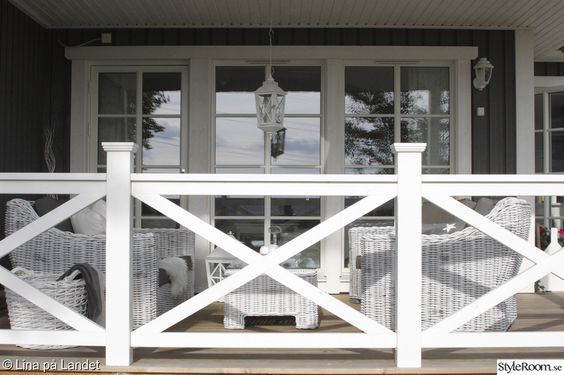 a white picket fence in front of a house