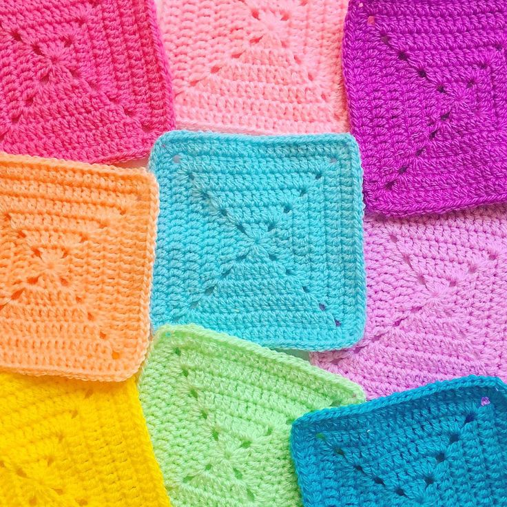 crocheted squares are arranged in different colors