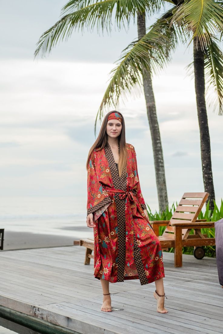 The perfect gift for anyone who loves the finer moments in life, this soft and sexy kimono robe is crafted by hand with strong attention to detail. With a gorgeous print and exclusive stitches, it's perfect for an extended variety of use. Elevate your kimono experience with the luxurious touch of our blended silk viscose fabric. This exquisite material harmoniously combines the elegance of silk with the comfort of viscose, resulting in a fabric that drapes effortlessly and exudes a subtle sheen. Bohemian V-neck Robe For Loungewear, Bohemian Open Front Robe For Loungewear, Bohemian Open Front Loungewear Robe, Multicolor Wrap Robe For Loungewear, Bohemian Floral Print Robe For Loungewear, Printed Bohemian Kimono For Loungewear, Bohemian Printed Kimono For Loungewear, Festival Robe With Printed Kimono Sleeves, Red Wrap Kimono For Festivals