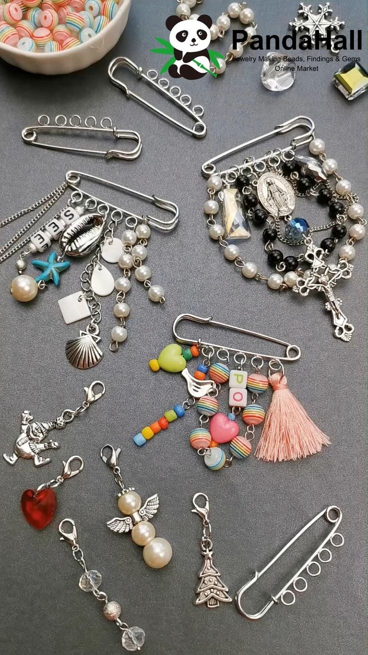 many different charms and bracelets on a table