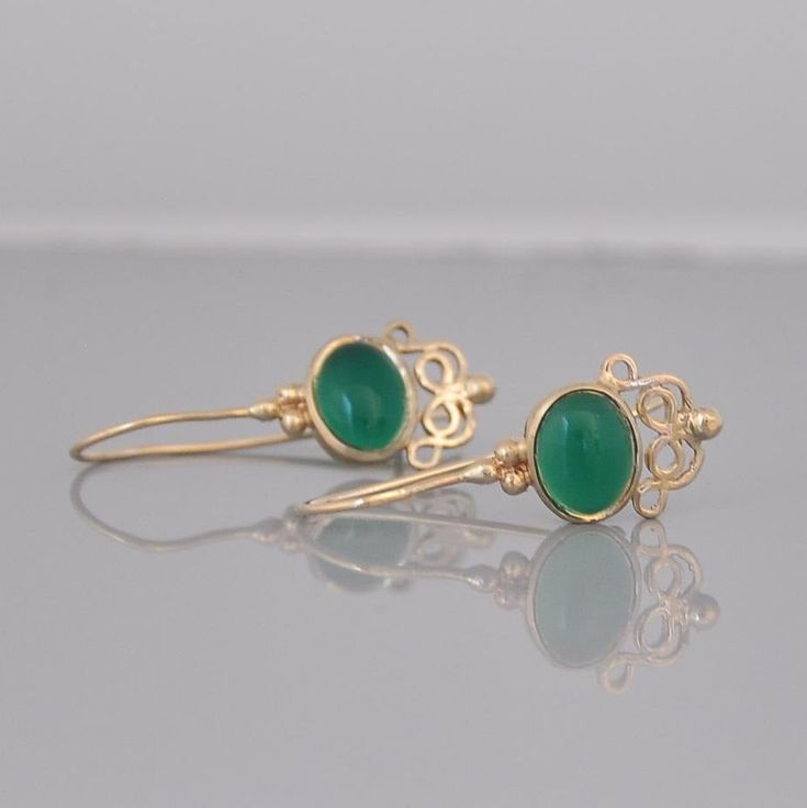 "These 14k gold dangle earrings and green Onyx gemstone are beautiful hanging earrings that you can buy as a gift for you or for a friend. You will love the gold and green color combination of these gemstone earrings. The solid gold and the green Onyx stone are so beautiful together that you will want to look at all the time :-) These gemstone earrings can be made with other type of stones end every new combination is a surprise for me. I can make these earrings in 14k roes gold. The earrings ar Elegant Green Onyx Gold Earrings, Elegant Green Onyx Drop Earrings, Formal Green Onyx Gemstone Jewelry, Elegant Green 14k Gold Earrings, Green Onyx Drop Earrings, Elegant Green Onyx Earrings For Gift, Elegant Green Onyx Dangle Earrings, Elegant Green Onyx Dangle Jewelry, Elegant Green Onyx Jewelry For May Birthstone