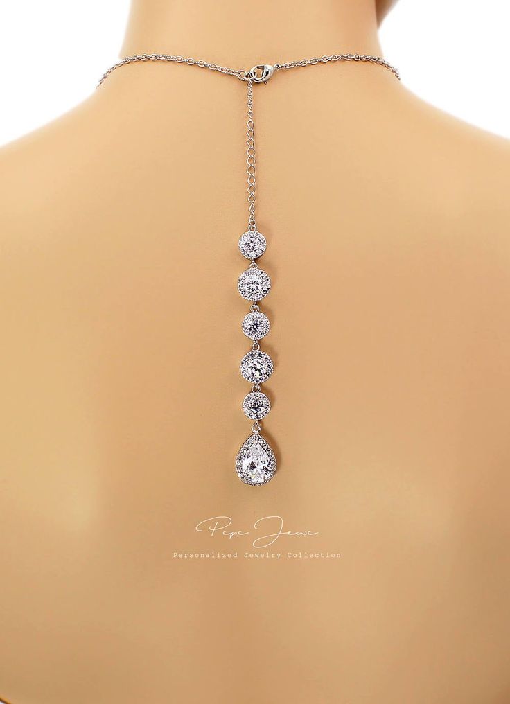 "Finish: Silver Platinum plated components Material: Top quality rhinestones, AAA Zirconia, lobster clasp. Length of Necklace: 17.5 inches and 5 3/4\" Zirconia backdrop. Length of Earrings: 1 1/4 inches from the top of the post. Quantity: Necklace + Earrings Weight: 10g + 35g Items Condition: 100% Brand New You can find this collection here: https://www.etsy.com/shop/PepeJewe?ref=listing-shop2-all-items-count&search_query=Perl You can find Zirconia jewelry here : https://www.etsy.com/shop/Pe Elegant Jewelry With Handset Stones For Gift, Elegant Jewelry With Handset Stones As A Gift, Elegant Adjustable Jewelry With Handset Stones, Cubic Zirconia Jewelry With Handset Stones As Gift, Hand Set Silver Drop Jewelry, Gift Jewelry With Handset Crystal Stones, Adjustable Silver Round Bridal Necklace, Anniversary Jewelry With Handset Cubic Zirconia Stones, Silver Adjustable Bridal Necklace