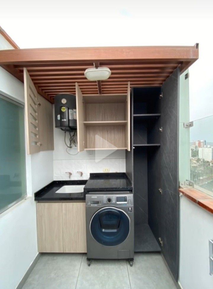 a washer and dryer in a small room