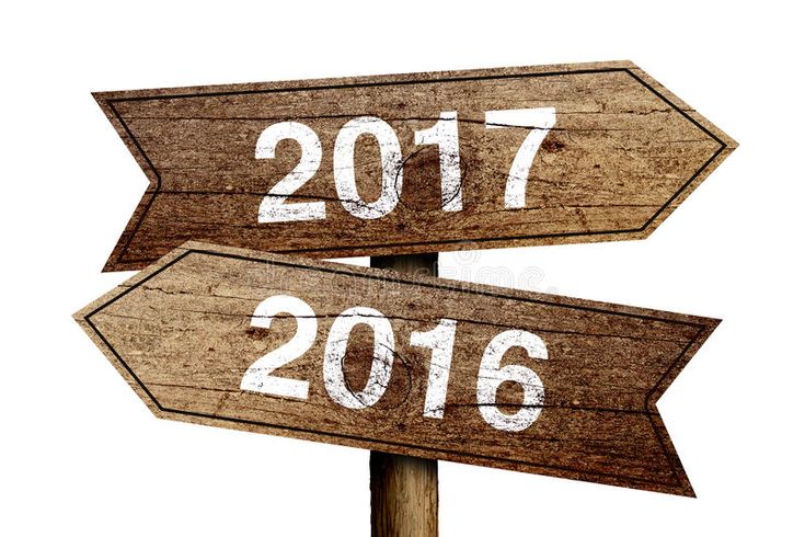 two wooden signs pointing in opposite directions with the word 2016 and 2015 written on them