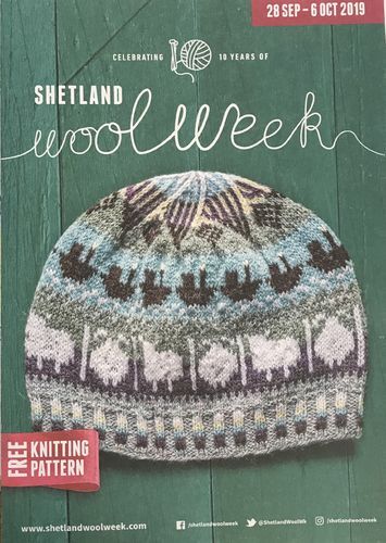 the knitting pattern for shetland woolwork is shown in front of a green wooden background