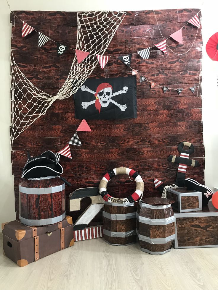 a pirate themed party with wooden barrels and decorations